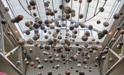 250 hollow ceramic boulders suspended in the air